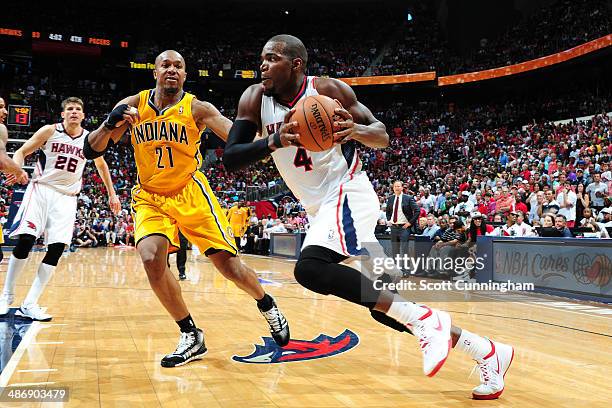 Paul Millsap of the Atlanta Hawks drives to the basket against the Indiana Pacers during Game Four of the Eastern Conference Quarterfinals on April...