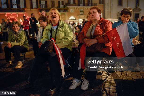 Pilgrims from Poland attend a Mass celebration in front of the Church of Santa Agense in Agona, at Piazza Navona on April 26, 2014 in Rome, Italy....