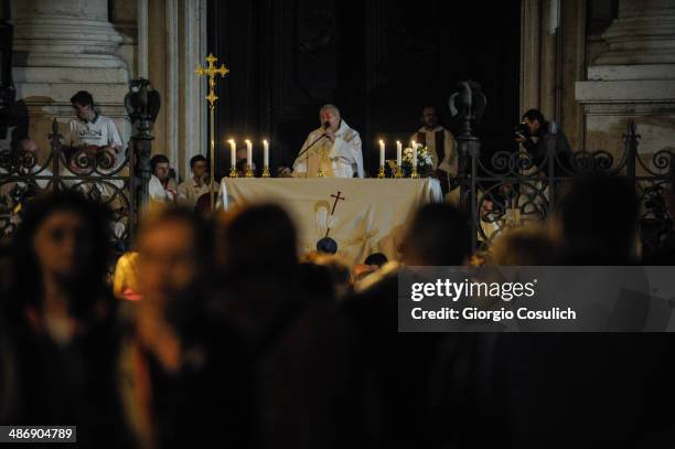 Pilgrims attend a Mass celebration in front of the Church of Santa Agense in Agona, at Piazza Navona on April 26, 2014 in Rome, Italy. Dignitaries,...