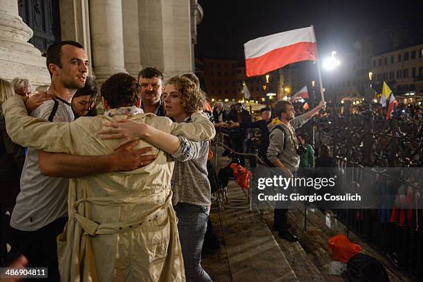 Pilgrims from Poland attend a Mass celebration in front of the Church of Santa Agense in Agona, at Piazza Navona on April 26, 2014 in Rome, Italy....