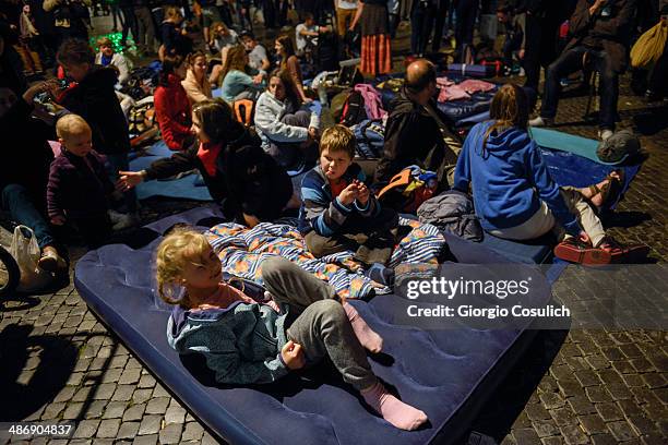 Pilgrims from Poland get ready to spend the night after a Mass celebration in front of the Church of Santa Agense in Agona, at Piazza Navona on April...