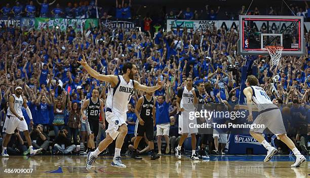 Jose Calderon of the Dallas Mavericks celebrates after Vince Carter of the Dallas Mavericks made the game winning shot against the San Antonio Spurs...