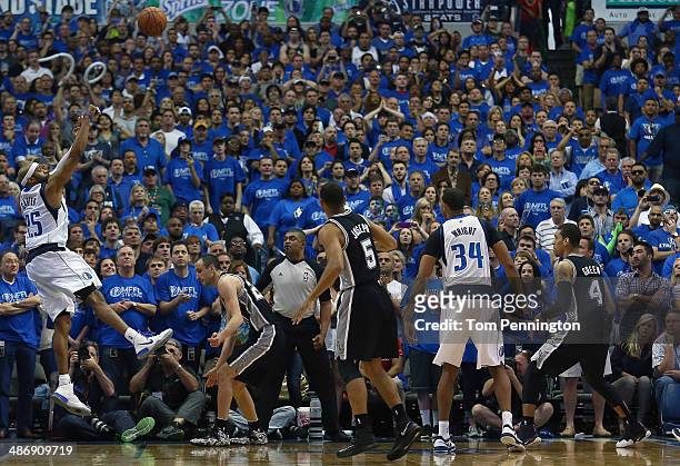 Vince Carter of the Dallas Mavericks shoots the game winning shot as the Mavericks beat the San Antonio Spurs 109-108 during Game Three of the...