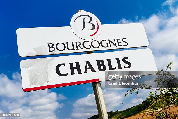 chablis road sign - burgundy france stock pictures, royalty-free photos & images