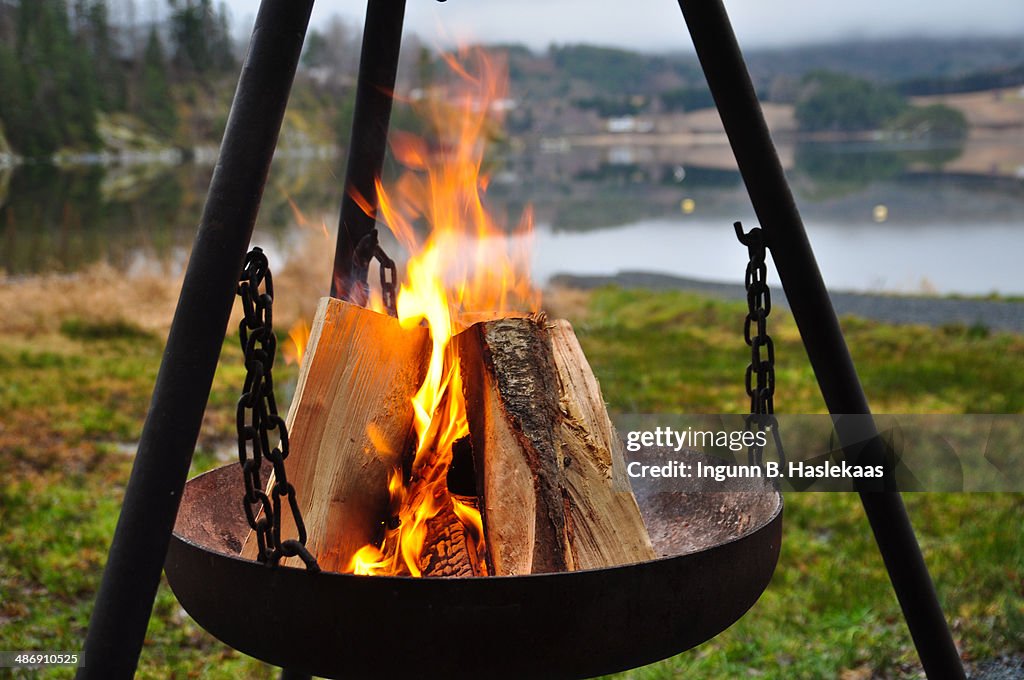 Portable fireplace by the lake