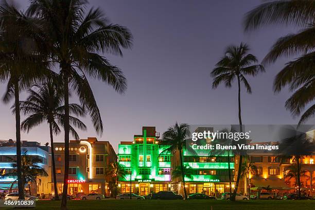 illuminated art deco buildings in ocean drive - miami nightclub stock pictures, royalty-free photos & images