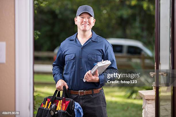 service industry: repairman at customer's front door. - tradesman toolkit stock pictures, royalty-free photos & images