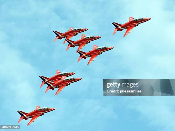 red arrows low level - red arrow plane stock pictures, royalty-free photos & images