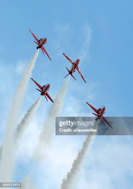 red arrows 'mirror' - red arrow plane stock pictures, royalty-free photos & images