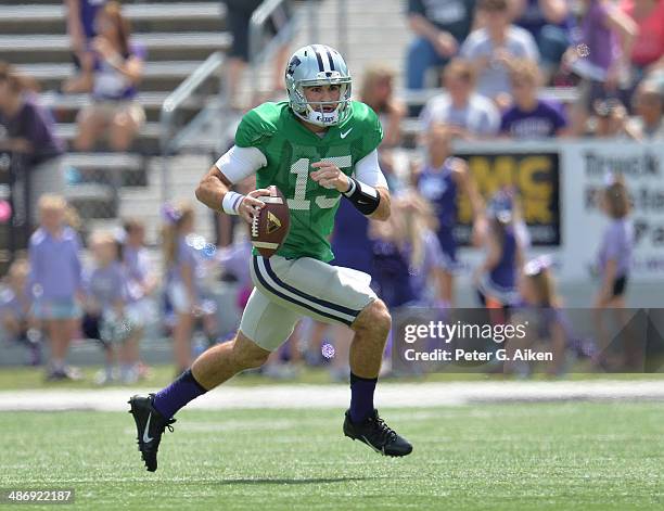 Quarterback Jake Waters of the Kansas State Wildcats rushes down field during the Spring Game on April 26, 2014 at Bill Snyder Family Stadium in...