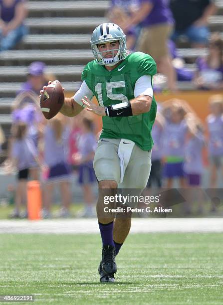 Quarterback Jake Waters of the Kansas State Wildcats looks down field during the Spring Game on April 26, 2014 at Bill Snyder Family Stadium in...