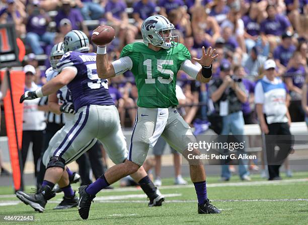 Quarterback Jake Waters of the Kansas State Wildcats throws a pass down field during the Spring Game on April 26, 2014 at Bill Snyder Family Stadium...