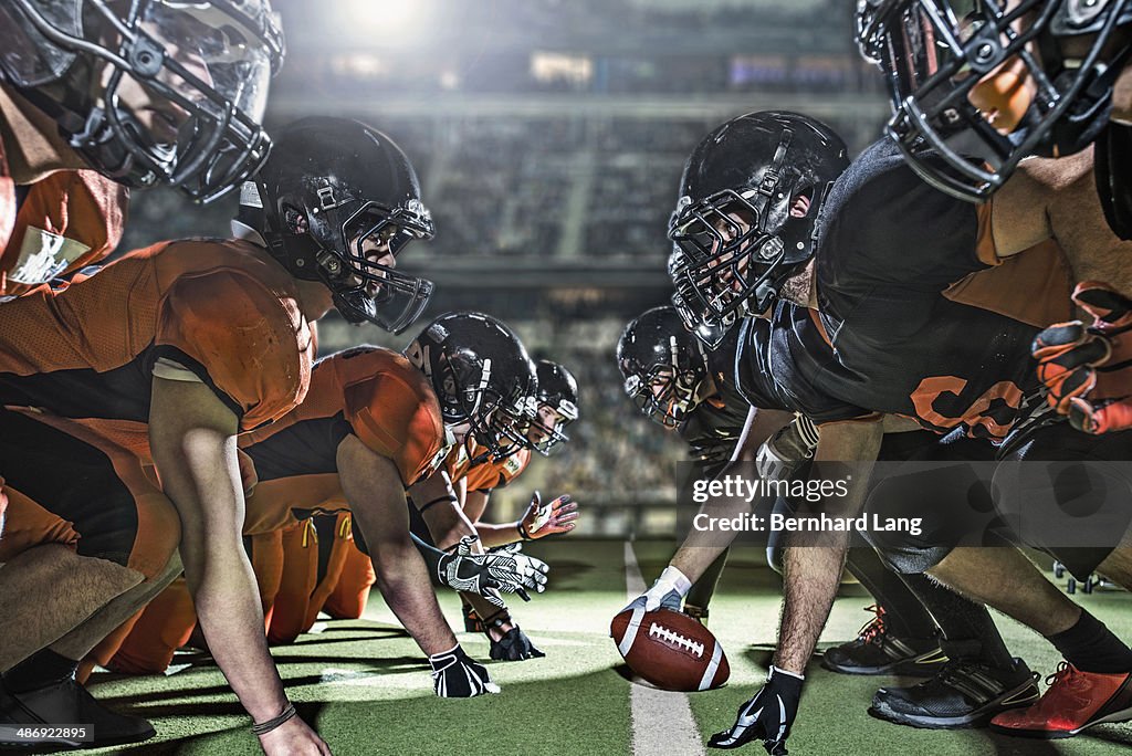 Two american football teams opposing in stadium