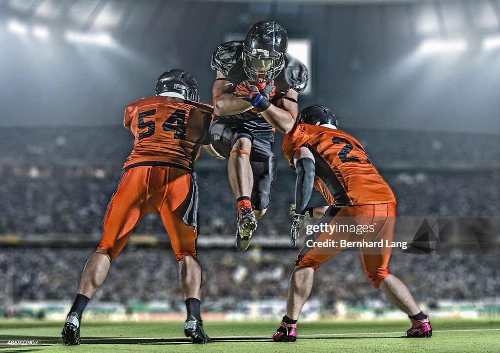 American football players in action