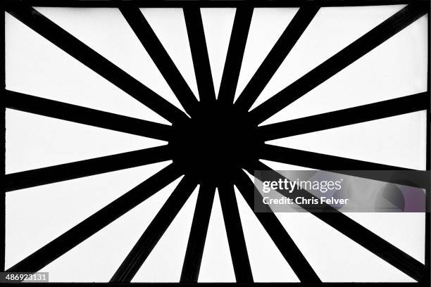 Abstract image of alternating, thin dark and thick light diagonal bands running toward a black dot located in the center, 2006. From The Ordered...