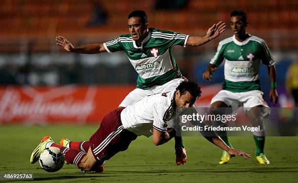 Tiago Alves of Palmeiras fights for the ball with Fred of Fluminense during the match between Palmeiras and Fluminense for the Brazilian Series A...