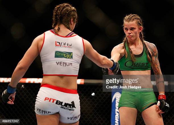 Opponents Jessamyn Duke and Bethe Correia shake hands after the conclusion of their women's bantamweight bout during the UFC 172 event at the...