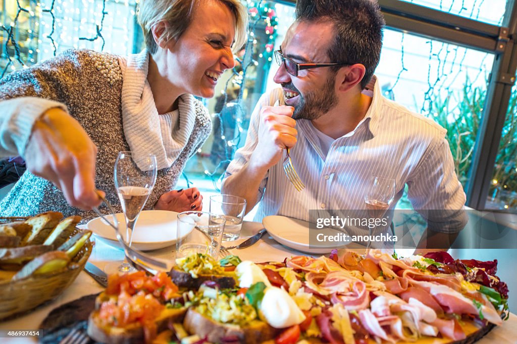 Couple having Christmas dinner in a restaurant