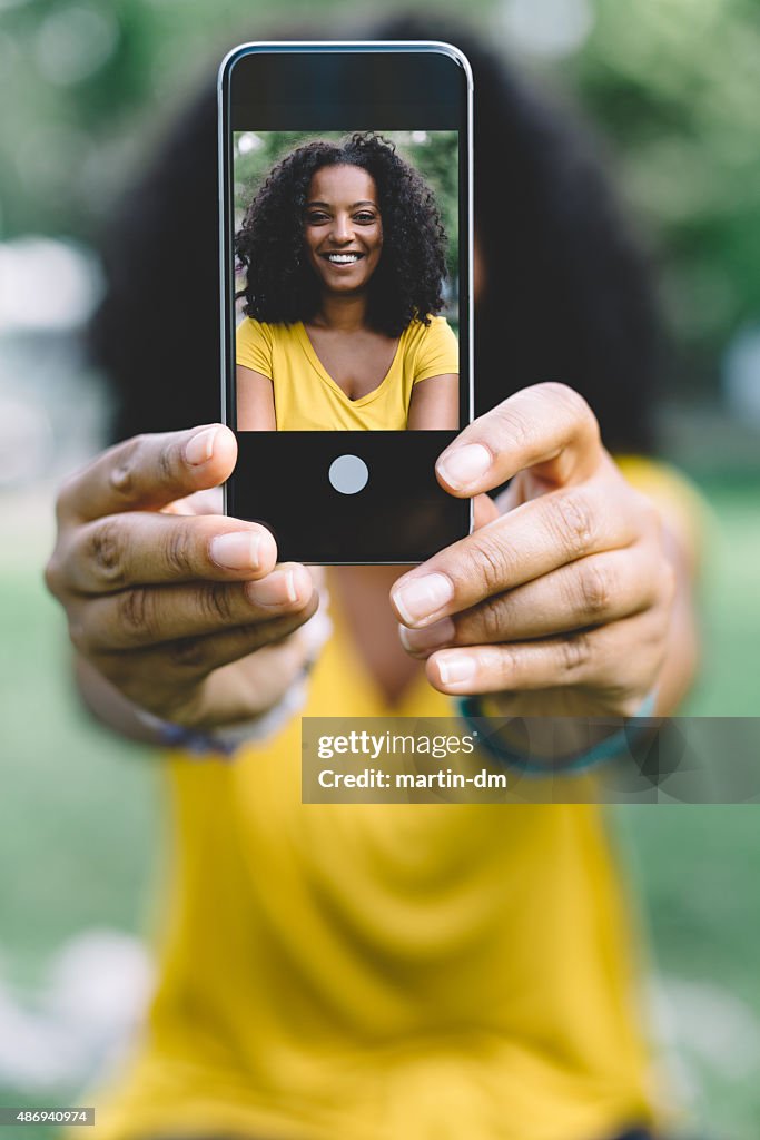 Smiling woman taking a selfie