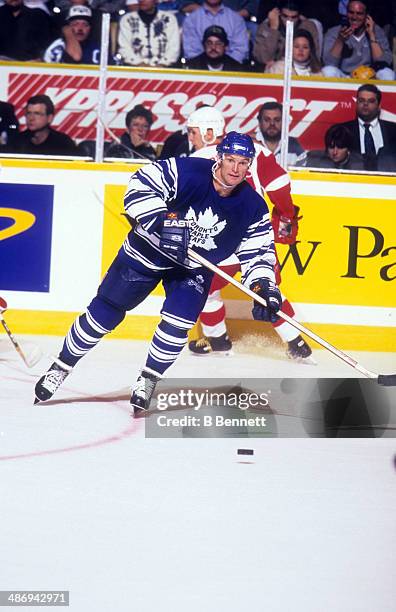 Kirk Muller of the Toronto Maple Leafs skates with the puck during an NHL game against the Detroit Red Wings on November 2, 1996 at the Maple Leaf...