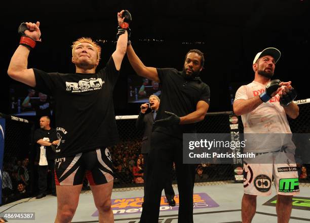 Takanori Gomi reacts after his decision victory over Isaac Vallie-Flagg in their lightweight bout during the UFC 172 event at the Baltimore Arena on...