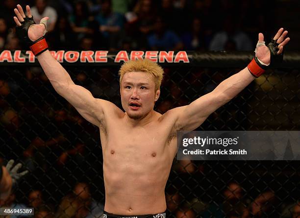 Takanori Gomi reacts to the crowd's applause before the third round of his lightweight bout against Isaac Vallie-Flagg during the UFC 172 event at...