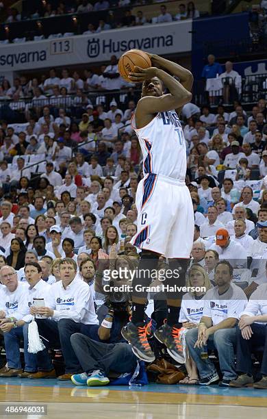 Michael Kidd-Gilchrist of the Charlotte Bobcats shoots against the Miami Heat in Game Three of the Eastern Conference Quarterfinals during the 2014...