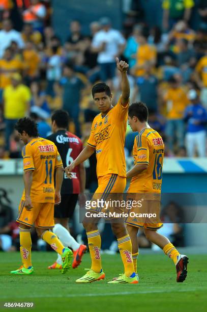 Hugo Ayala of Tigres celebrates with teammates after scoring the first goal of his team during a match between Tigres UANL and Atlas as part of 17th...