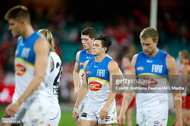 Dejected Jesse Lonergan of the Suns leaves the field during the round 23 AFL match between the Sydney Swans and the Gold Coast Suns at Sydney Cricket...