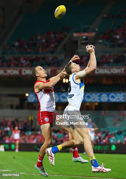 Ted Richards of the Swans competes for the ball against Tom Lynch of the Suns during the round 23 AFL match between the Sydney Swans and the Gold...