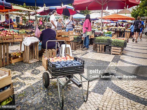 Wheelbarrow with fruit in a farmers market, Caldas da Rainha, Portugal