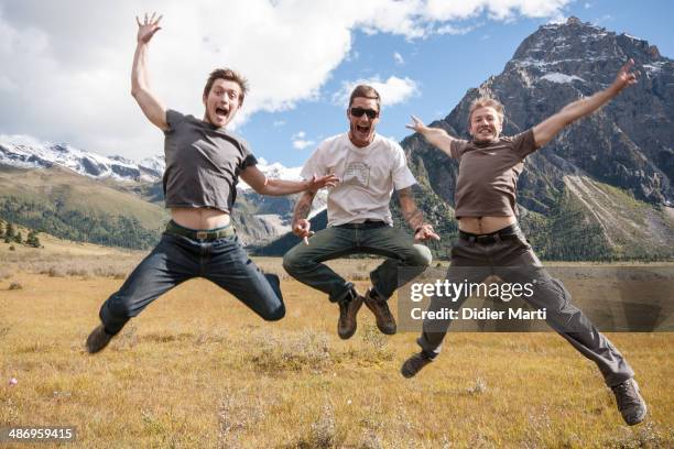 Young men jumping near Yilhun Lhatso lake in Dege county in Sichuan province in China