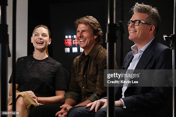 Rebecca Ferguson, Tom Cruise, and Director Christopher McQuarrie, reacts during a tele-broadcasting with fans in a cinema in Chengdu on August 5,...