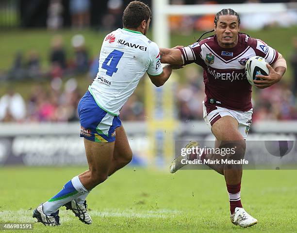 Steve Matai of the Sea Eagles is tackled by Matt Allwood of the Raiders during the round 8 NRL match between the Manly-Warringah Sea Eagles and the...