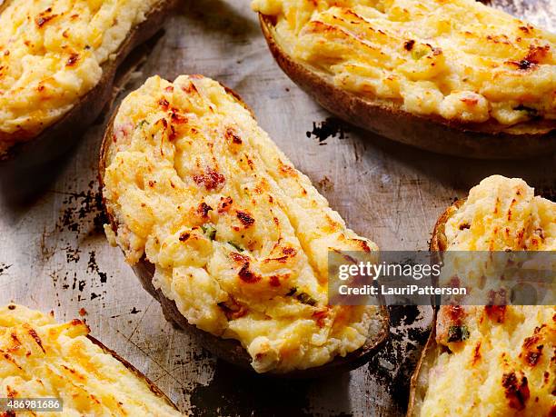 twice baked, stuffed potatoes with cheese and bacon - stuffed potato stock pictures, royalty-free photos & images