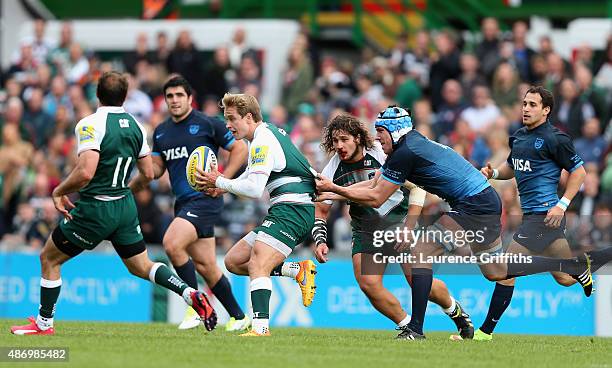 Mathew Tait of Leicester Tigers is tackled by Guido Petti Pagadizabal of Argentina during the Testimonial Challenge match between Leicester Tigers...