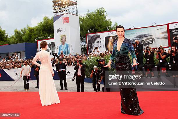 Lou de Laage and Juliette Binoche attend a premiere for 'The Wait' during the 72nd Venice Film Festival on September 5, 2015 in Venice, Italy.