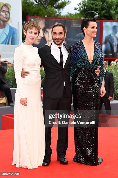 Lou de Laage, Piero Messina and Juliette Binoche attend a premiere for 'The Wait' during the 72nd Venice Film Festival at Palazzo del Casino on...