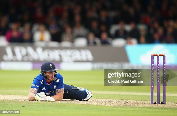 Ben Stokes of England looks back at his wicket after diving to make his ground subsequently being given out for obstruction off the bowling of...