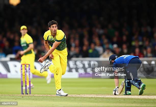 Mitchell Starc of Australia throws the ball at the wicket of Ben Stokes of England and the ball hits the hand of Ben Stokes who is subsequently given...