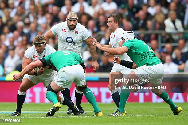 Tom Youngs of England is challenged by Paul O'Connell of Ireland during the QBE International match between England and Ireland at Twickenham Stadium...