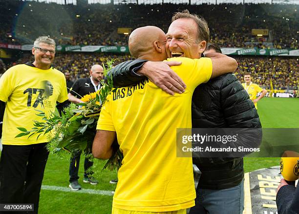 Hans-Joachim Watzke with Leonardo de Deus Santos during the farewell match of Dede at Signal Iduna Park on September 5, 2015 in Dortmund, Germany.