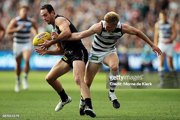Matthew Broadbent of the Power competes for the ball with George Horlin-Smith of the Cats during the round six AFL match between Port Adelaide Power...