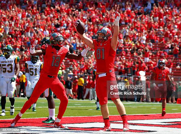 Matt Flanagan of the Rutgers Scarlet Knights celebrates his touch down with teammate Carlton Agudosi during the first half against the Norfolk State...