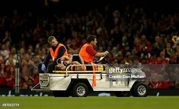 Leigh Halfpenny of Wales is stretchered off the field after suffering a leg injury during the International Match between Wales and Italy at...