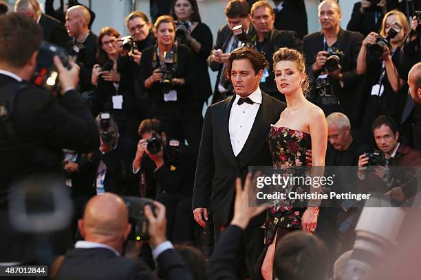 Johnny Depp and actress Amber Heard attend a premiere for 'The Danish Girl' during the 72nd Venice Film Festival at on September 5, 2015 in Venice,...