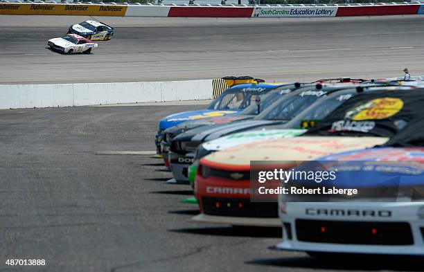 Television personality and former NASCAR driver Kyle Petty drives an exhibition run in the 1972 Wood Brothers Racing Mercury prior to qualifying for...