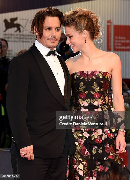 Johnny Depp and actress Amber Heard attend a premiere for 'The Danish Girl' during the 72nd Venice Film Festival at on September 5, 2015 in Venice,...