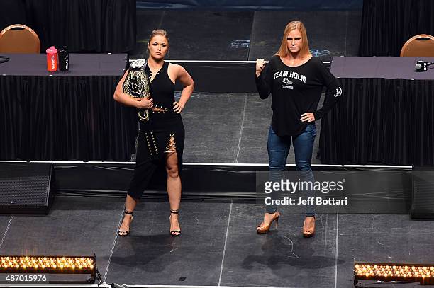 Women's bantamweight champion Ronda 'Rowdy' Rousey and challenger Holly Holm pose for the media during the UFC's Go Big launch event inside MGM Grand...