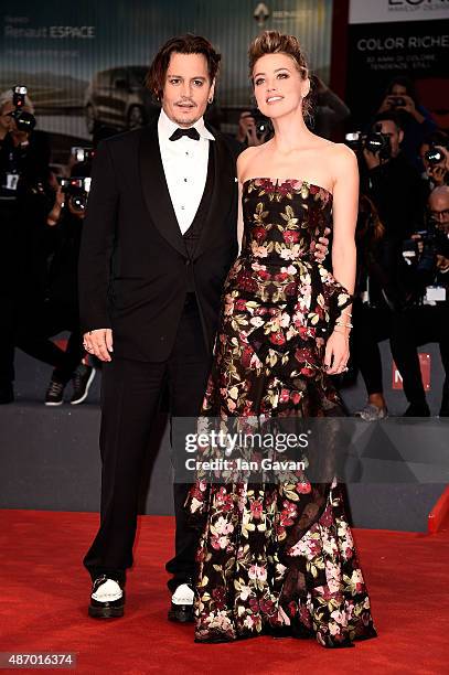 Johnny Depp and actress Amber Heard attend a premiere for 'The Danish Girl' during the 72nd Venice Film Festival at on September 5, 2015 in Venice,...